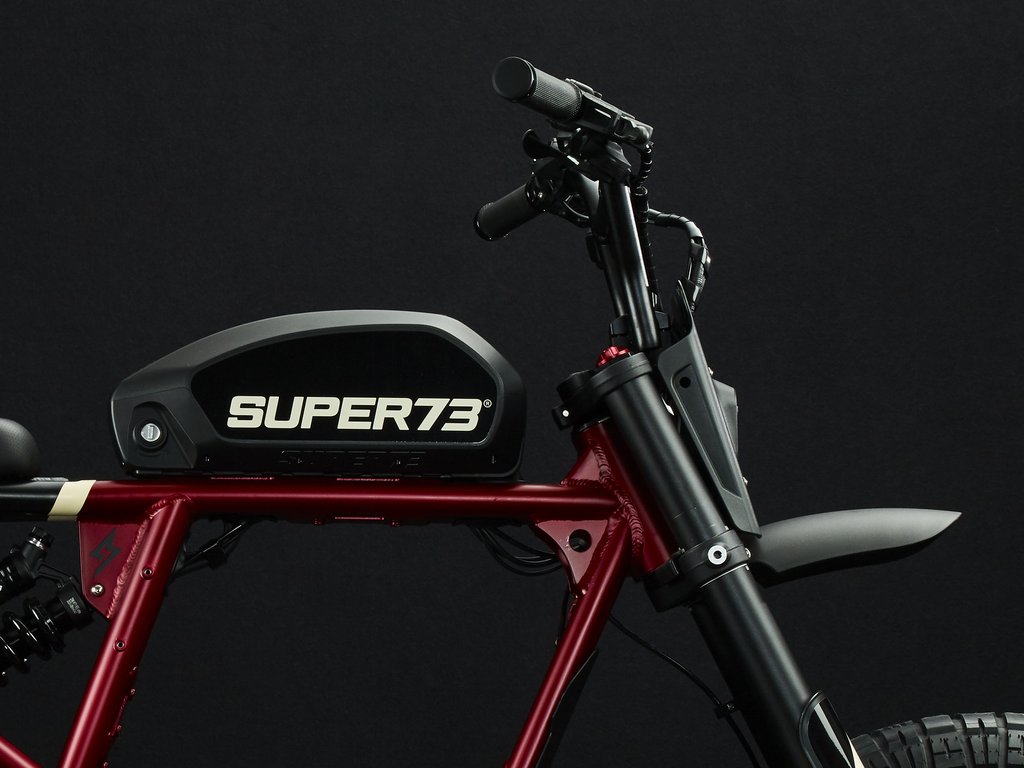 Super73-RX Carmine Red The RX debuts Super73’s most powerful and technologically advanced drive system with multi-class ride modes. This performance vehicle is a street-legal electric motorbike that does not require a license or registration. The RX also features Super73’s all-new connected electronics suite and is compatible with iOS and Android mobile devices through the new Super73 App.