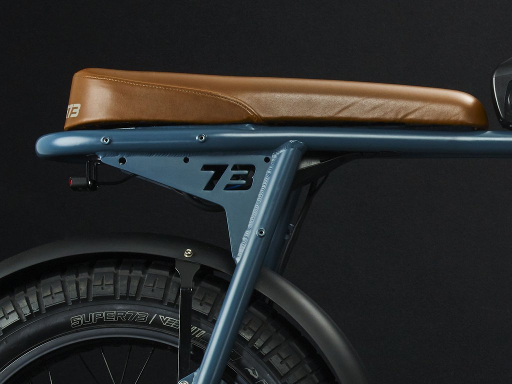 SUPER73-S2 Hudson Blue The Super73-S2 is a high performance street-legal electric motorbike that does not require a license or registration. Designed for the urban adventurer, the agile S2 is a sport-cruiser style motorbike built with an aircraft-grade aluminum alloy frame and a fully adjustable air spring suspension fork. The S2 also features Super73's all-new connected electronics suite that is compatible with iOS and Android mobile devices through the new Super73 App.