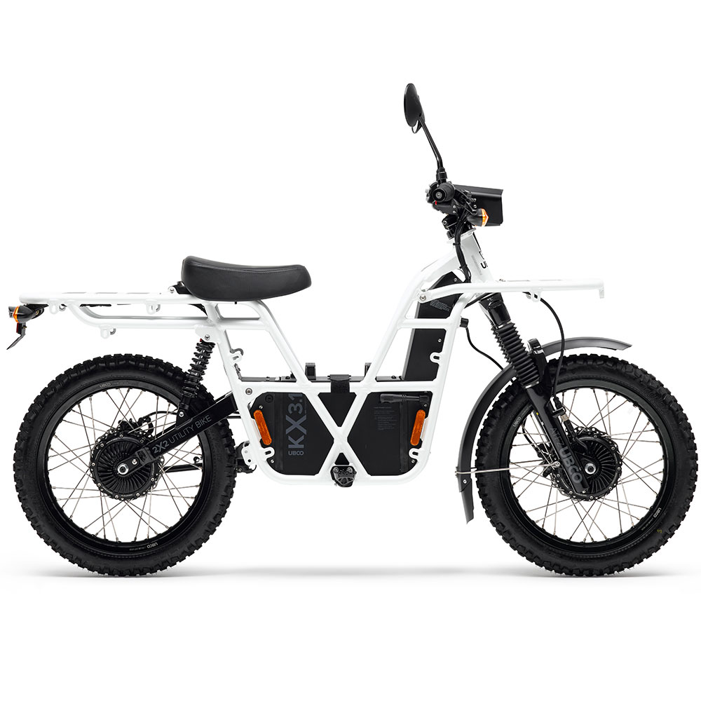 UBCO 2X2 Adventure Bike - White On-road or off-road, this electric motorbike is conveniently lightweight, making it easy to lift onto your van, truck or RV. Humming under 75dB with a range up to 120km, you can discover new far off places while enjoying the sound of nature. With a total carry weight of 150kg you can take the bigger tent and the extra pots without all the fuss. Top speed 45km/h | 28mph Weight incl. power supply 66-71kg | 145-156lb Max range 70-120km | 43-75mi